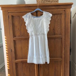 Gorgeous summer dress! All white has some see through lace detailing.